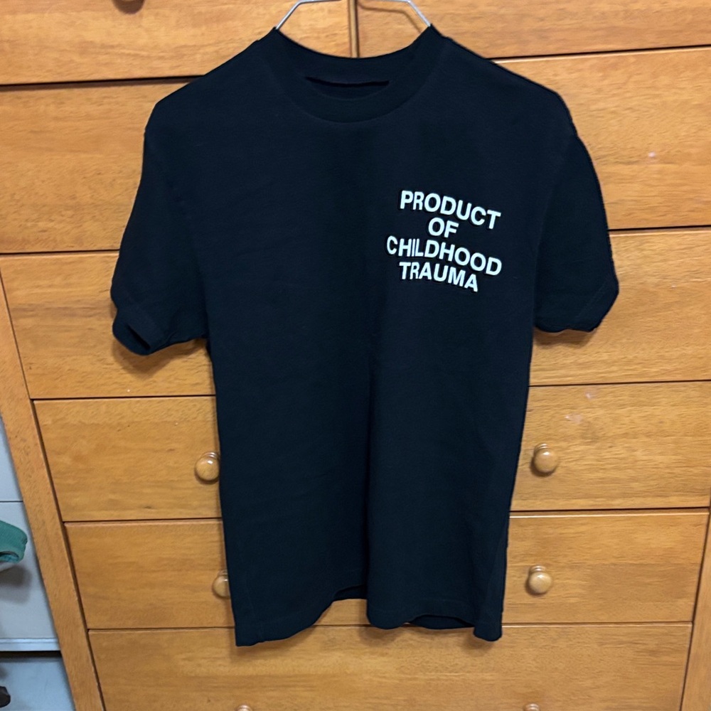 Black Graphic Tee "Product of Childhood Trauma"